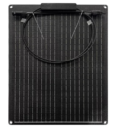 Portable solar panel charging an auxiliary battery beside a touring four-wheel-drive