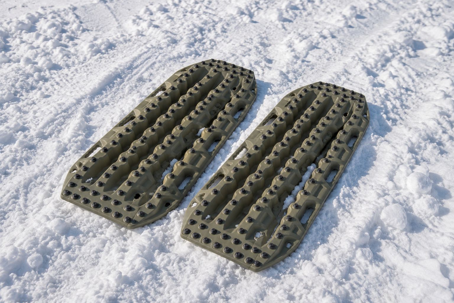 Recovery boards being used to provide traction in deep snow