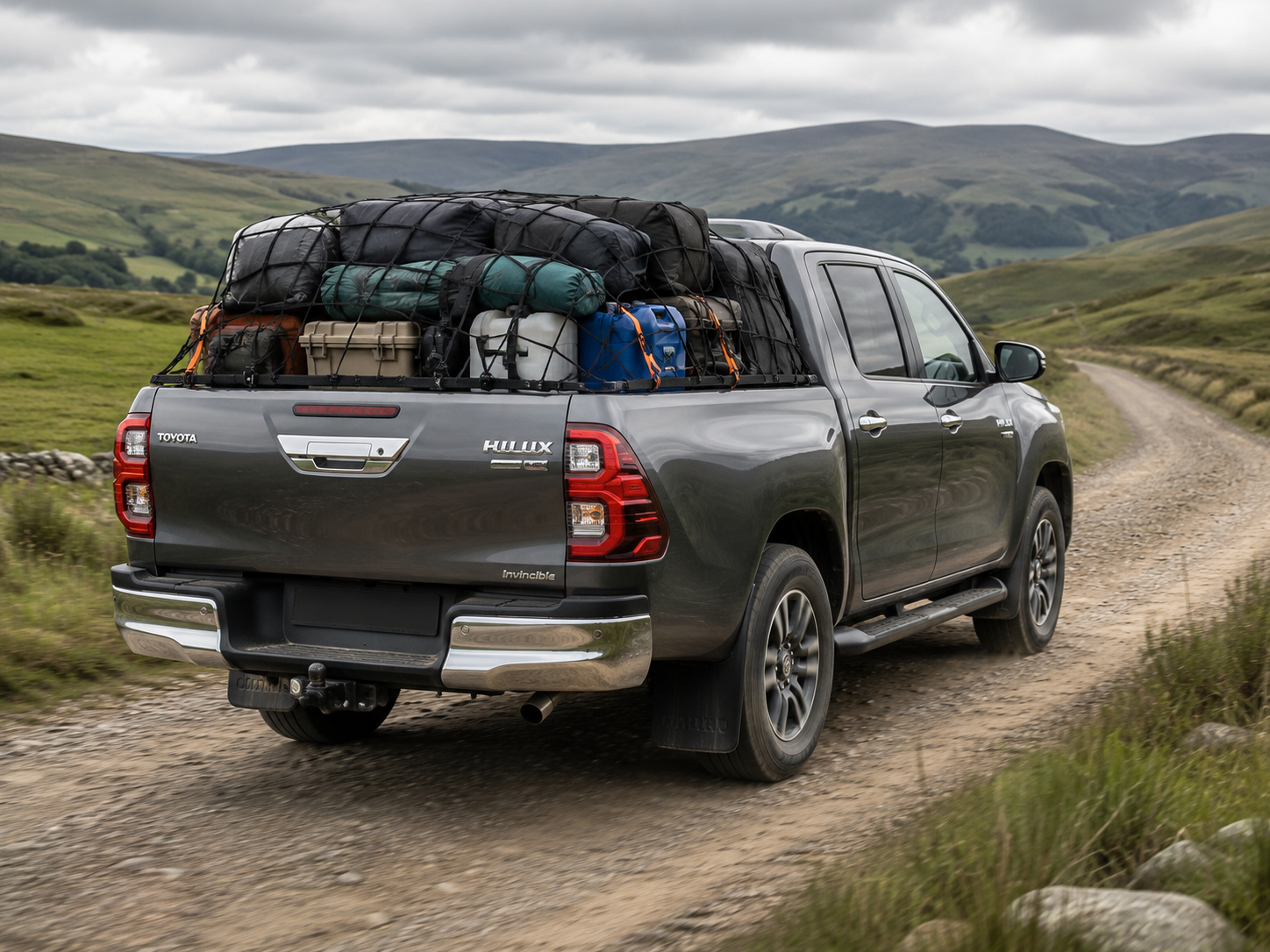 Pickup carrying heavy equipment in its load bed
