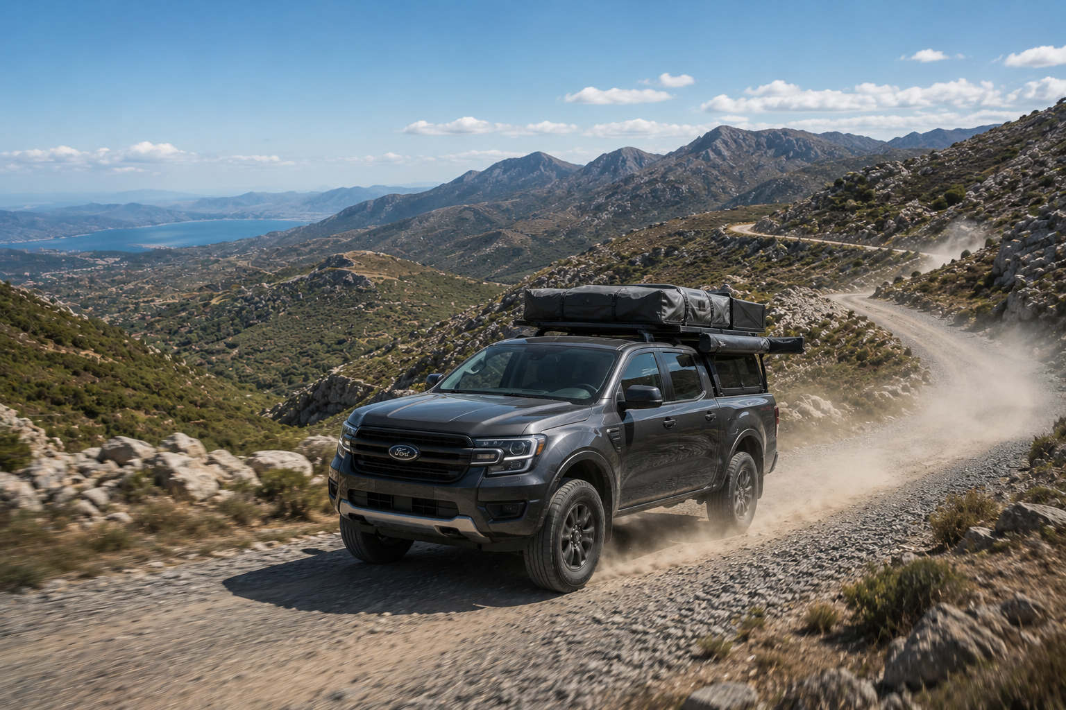 Loaded overland vehicle travelling through remote terrain