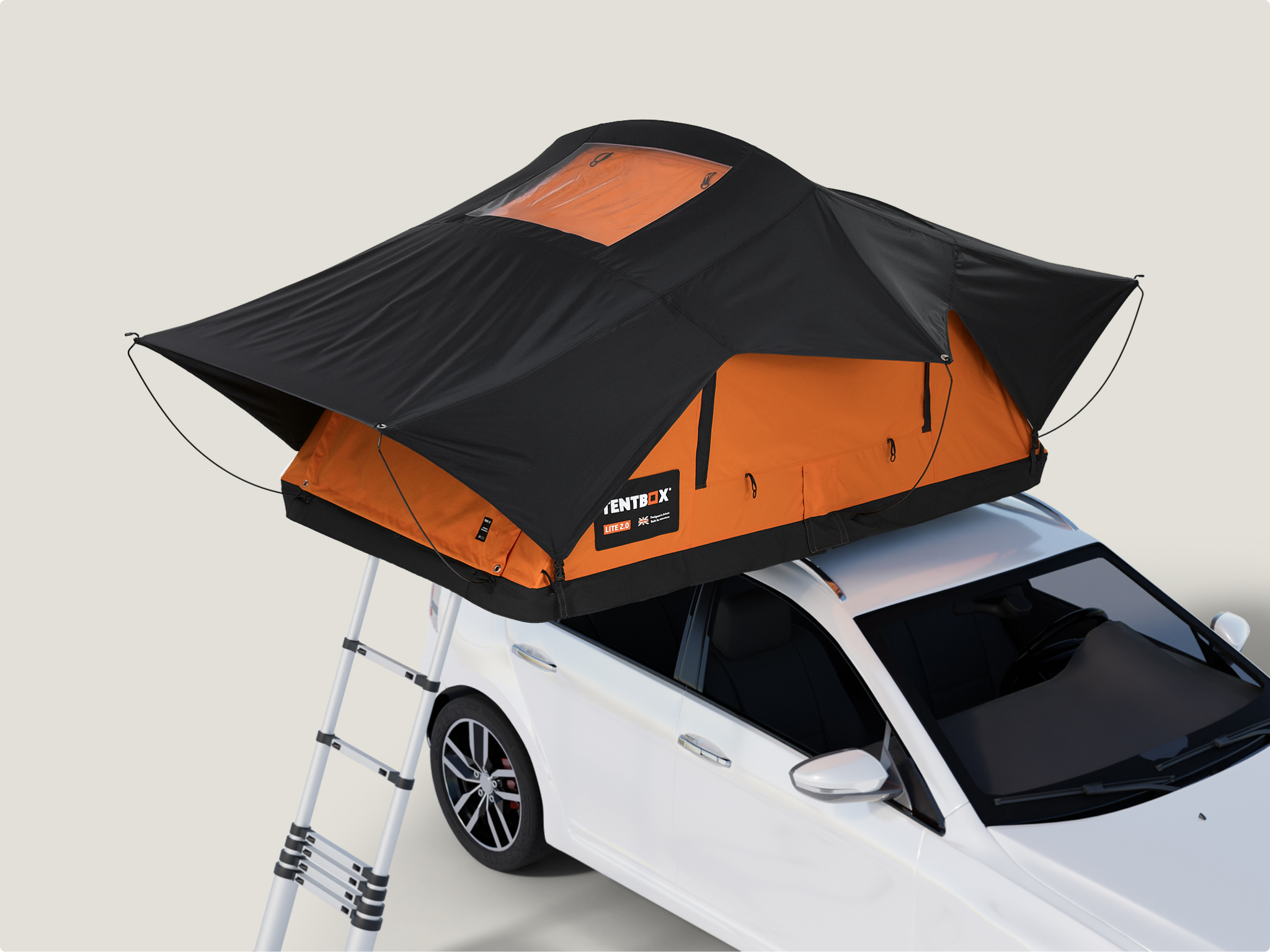 Roof tent mounted to a four-wheel-drive at a campsite