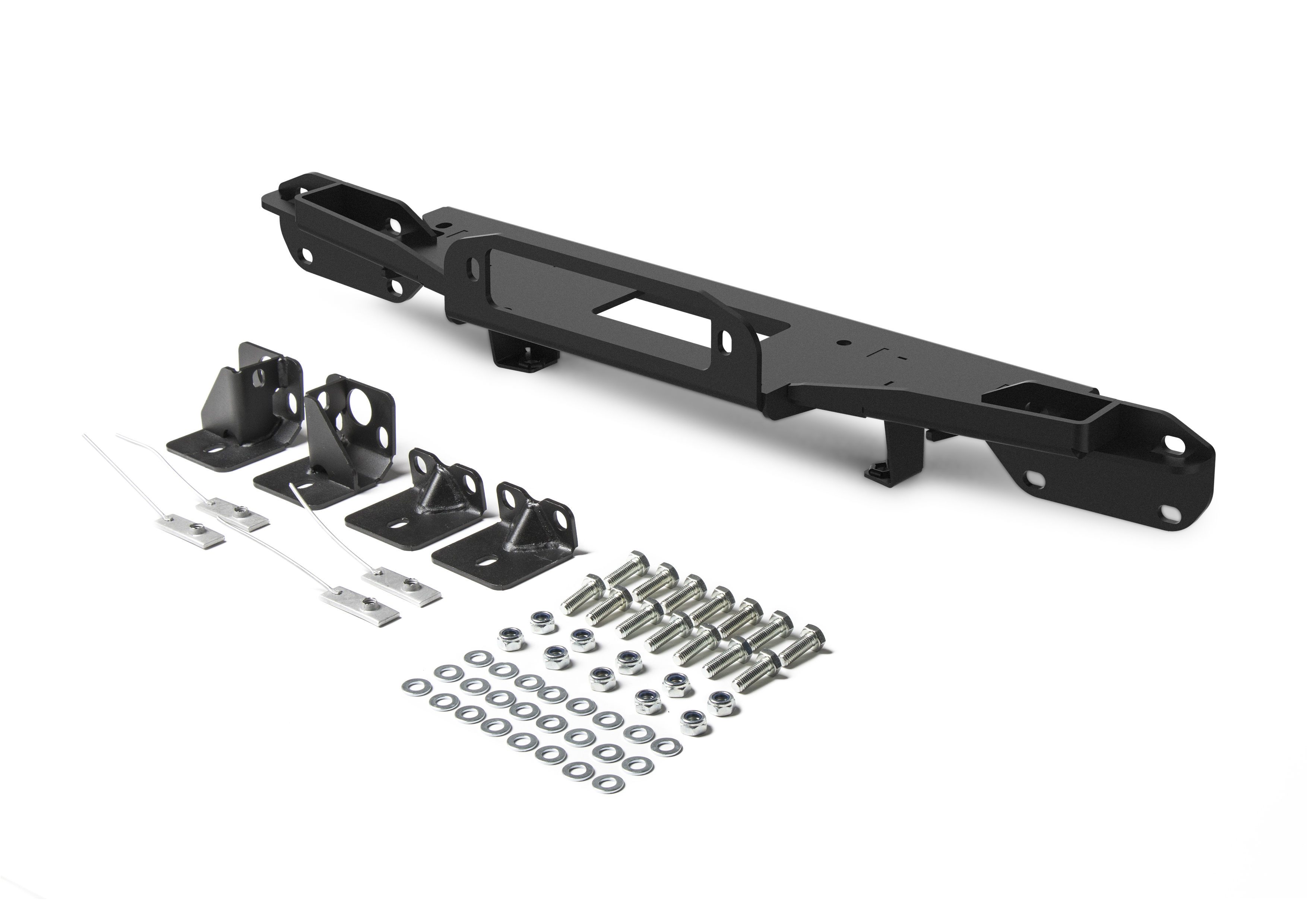 Vehicle-specific winch mounting system behind a recovery bumper